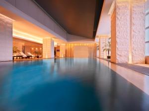 an empty swimming pool in a hotel lobby at Jumeirah Himalayas Hotel Shanghai in Shanghai
