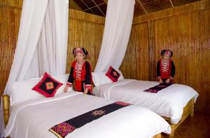 Postel nebo postele na pokoji v ubytování Hoang Su Phi Lodge