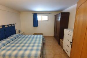 Кровать или кровати в номере Appartamento Il GIRASOLE