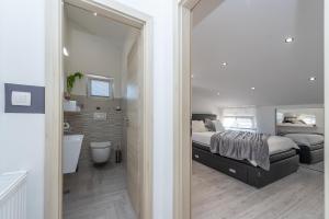 Posteľ alebo postele v izbe v ubytovaní Apartments Luky