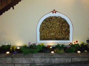 a wall with a pile of fire wood at Appartamenti Riz Claudio in Campitello di Fassa