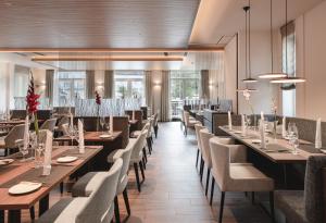 a dining room with long tables and chairs at Sympathie-Hotel Fürstenhof in Bad Kreuznach