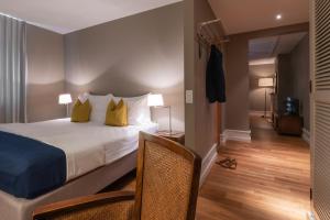 Postel nebo postele na pokoji v ubytování Blue City Boutique Hotel