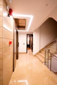 a hallway with a staircase in a building at Hotel City Pride in New Delhi