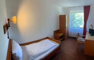 Postel nebo postele na pokoji v ubytování Hotel Rahlstedter Hof
