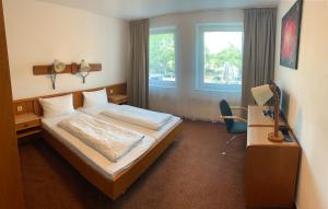 Postel nebo postele na pokoji v ubytování Hotel Rahlstedter Hof