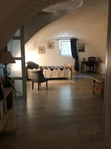 a living room with a couch and a window at Le Mas di Ro in Saint-Martin-dʼArdèche