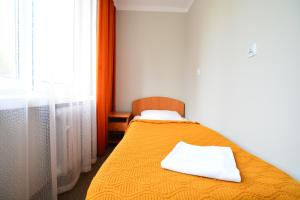 Postel nebo postele na pokoji v ubytování Hotel Felix