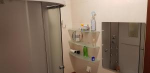 a bathroom with a shower with a mirror and a sink at GoraTwins guest house near Boryspil airport in Hora +31 photos