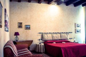 Postel nebo postele na pokoji v ubytování Anfiteatro B&B