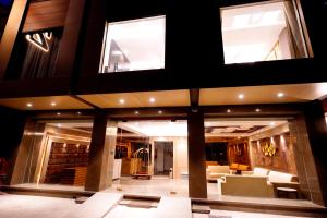 a large living room with couches and windows at Hotel City Pride in New Delhi