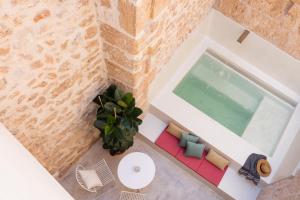 an overhead view of a living room with a pool at ARA Alcudia in Alcudia