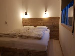En eller flere senge i et værelse på Zeeuwse Landhoeve