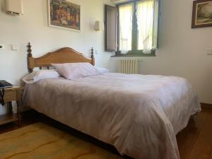 Postel nebo postele na pokoji v ubytování Hotel Siglo XVIII