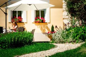 Vonkajšia záhrada v ubytovaní Boutique Hotel SwissHouse