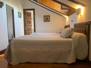 Postel nebo postele na pokoji v ubytování Hotel Siglo XVIII