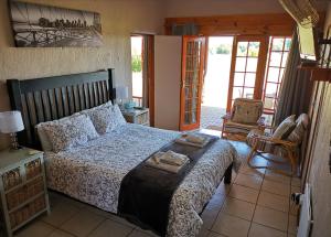 En eller flere senge i et værelse på Safe Haven Guesthouse Bloemfontein