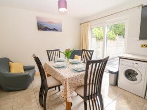 a kitchen and dining room with a table and chairs at At Home in Oak Park in Newcastle West