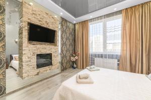 Säng eller sängar i ett rum på Apartments on the Black Sea