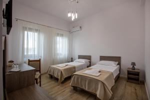 Ein Bett oder Betten in einem Zimmer der Unterkunft Airport House