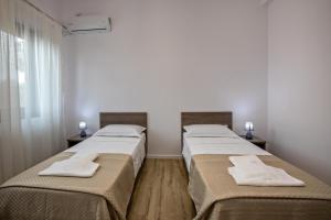 Ein Bett oder Betten in einem Zimmer der Unterkunft Airport House