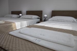 Ein Bett oder Betten in einem Zimmer der Unterkunft Airport House