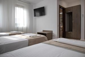 Ein Bett oder Betten in einem Zimmer der Unterkunft Airport House