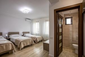 Ein Bett oder Betten in einem Zimmer der Unterkunft Airport House