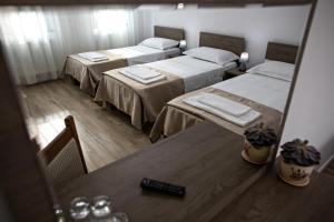 Ein Bett oder Betten in einem Zimmer der Unterkunft Airport House