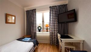 Voodi või voodid majutusasutuse Hotel Vännäs toas