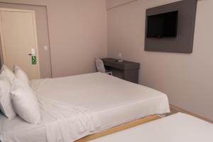Cama ou camas em um quarto em Abba Hotel