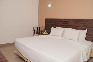Cama ou camas em um quarto em Abba Hotel