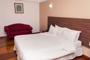 Cama ou camas em um quarto em Abba Hotel