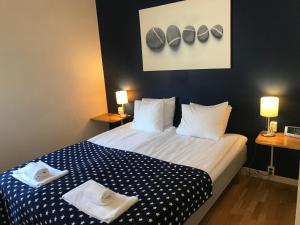 Letto o letti in una camera di Port Hotel