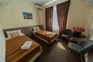 Postel nebo postele na pokoji v ubytování Шляпа + 37 fotografií