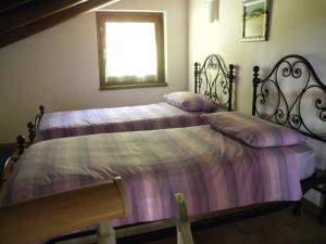 Postel nebo postele na pokoji v ubytování Agriturismo Piccolo paradiso