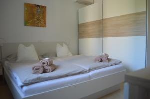 Postel nebo postele na pokoji v ubytování APARTMENT LUNA, IZOLA, San Simon