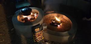 an overhead view of an oven with a fire at uilenkrallmond resort-cabin in Franskraal