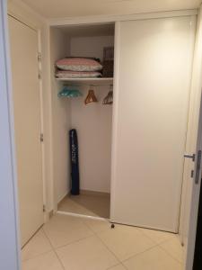 a walk in closet with a door open to a room at Cocooning in Menton