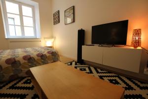 A bed or beds in a room at Colmar City Center - Quiet Studio ALSACE