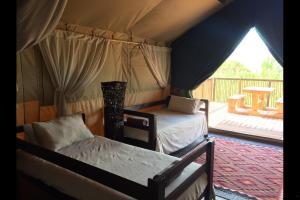 Postel nebo postele na pokoji v ubytování Otium Oasis Glamping & Camping + 37 fotografií