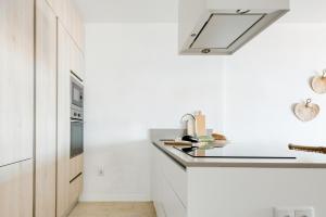 Apartamento Residencial Miramarにあるキッチンまたは簡易キッチン