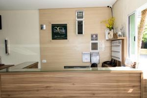 a kitchen with a glass counter top in a room at Pousada Du Valle in Embu