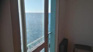 an ocean view from a window in a room at DEPARTAMENTO TORRE IV in Comodoro Rivadavia
