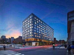 a tall building with windows on a city street at The Study at University City, Study Hotels in Philadelphia