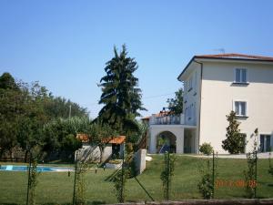 a house with a swimming pool and a fence at Residenza Don Agostino in Vallo della Lucania