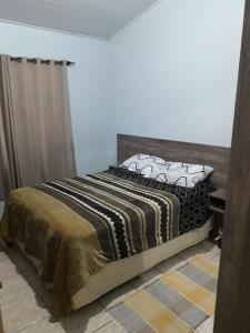Ένα ή περισσότερα κρεβάτια σε δωμάτιο στο Apartamento Bairro Ferraz +2 φωτογραφίες