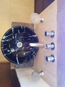 a bathroom sink with a glass counter top at Casa San Román in La Rioja