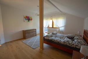 a bedroom with a bed and a large mirror at Józefina in Szczyrk