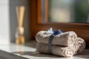 a pile of folded towels sitting on a table at Józefina in Szczyrk +17 photos
